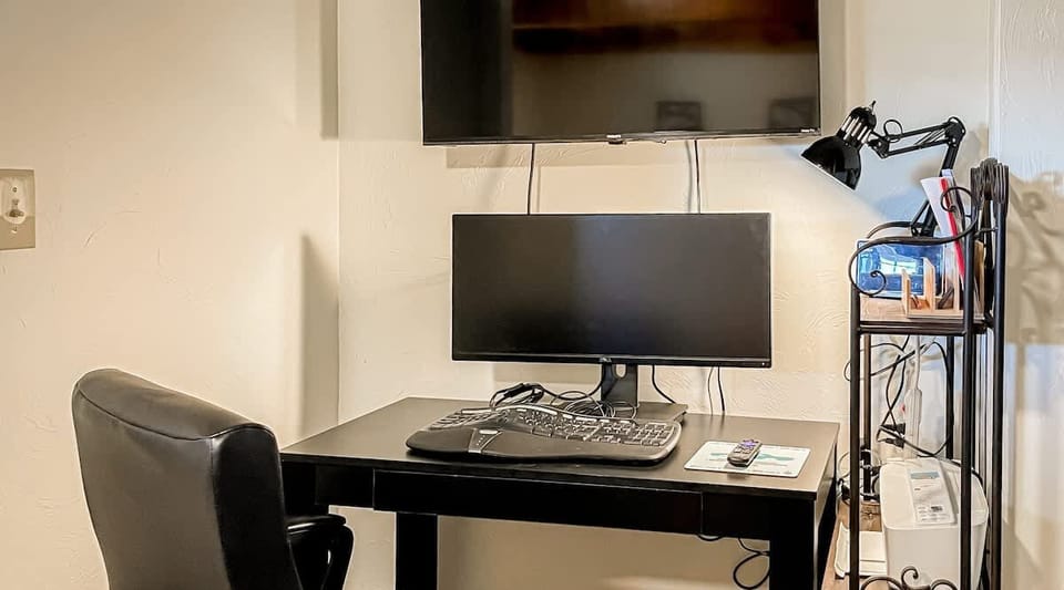 The master bedroom features a convenient workstation