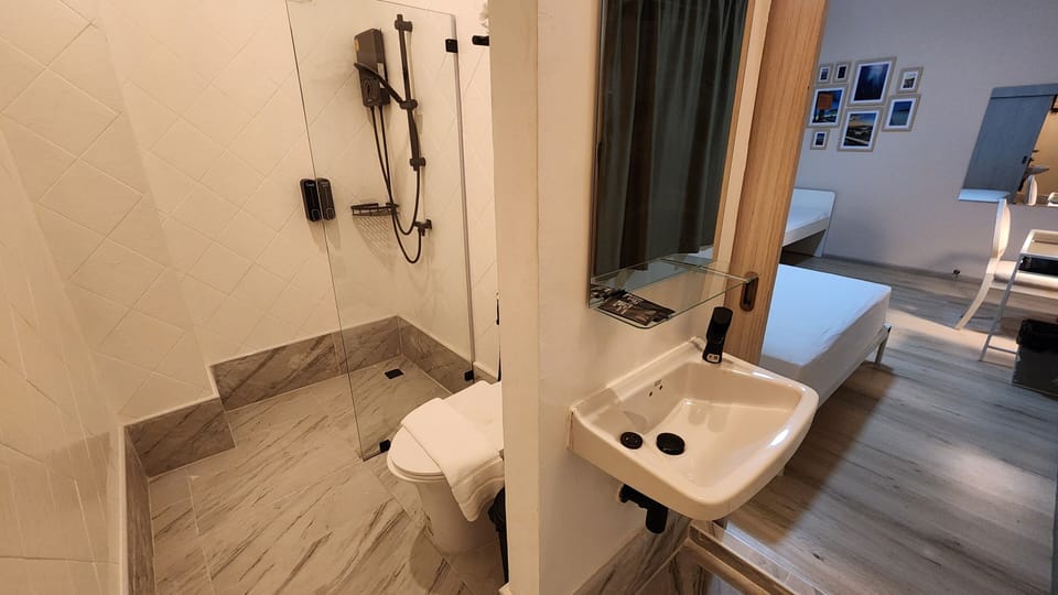 Standard Triple Room | Bathroom | Shower, hair dryer, towels, soap