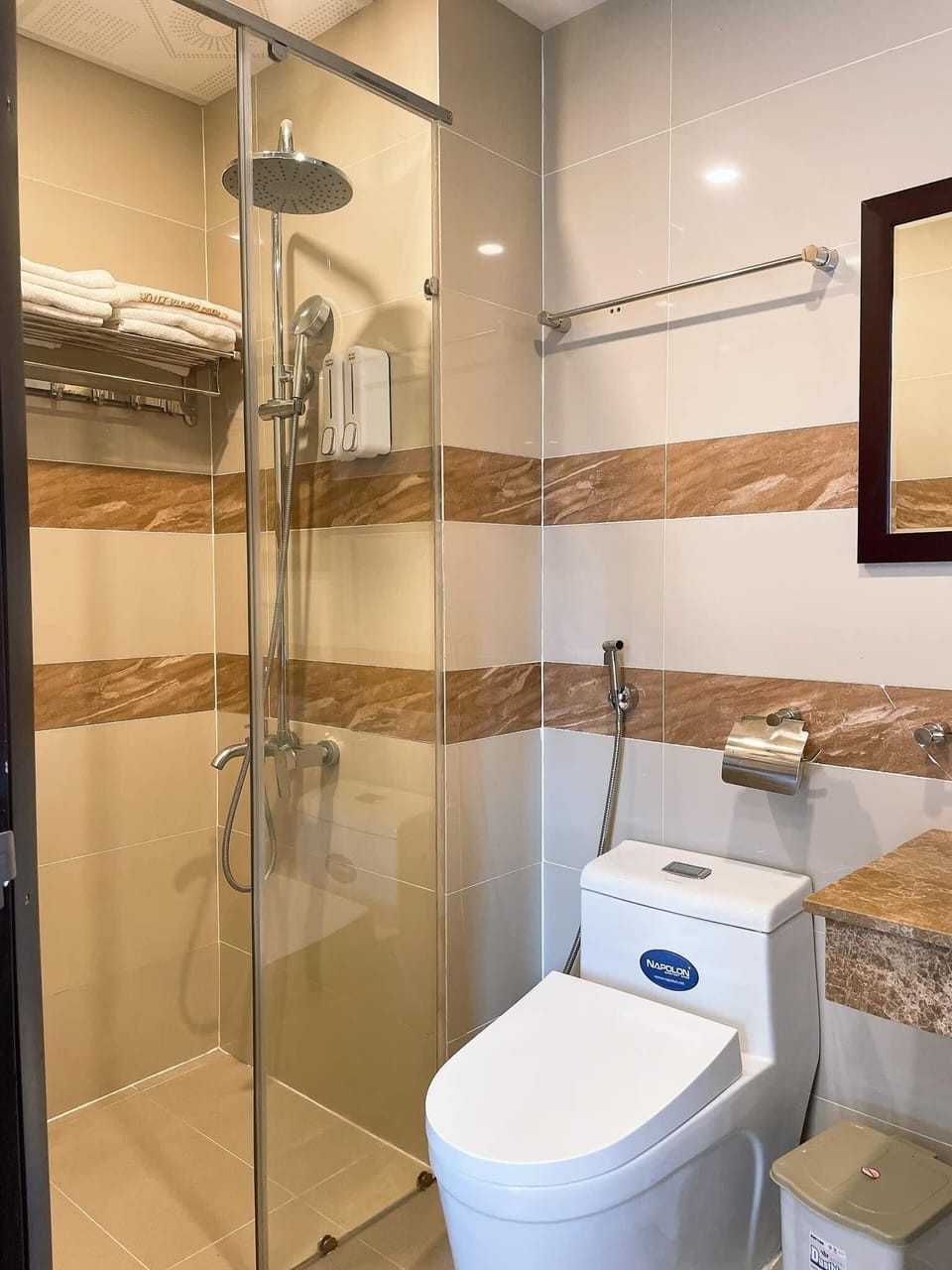 Shower, hair dryer, slippers, towels