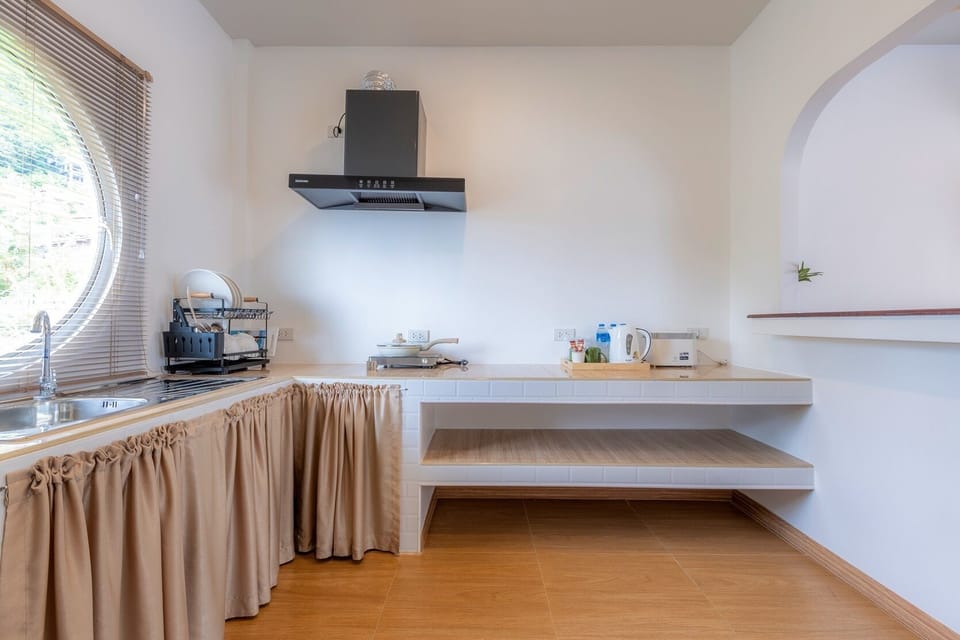 Deluxe Triple Room | Private kitchen | Mini-fridge