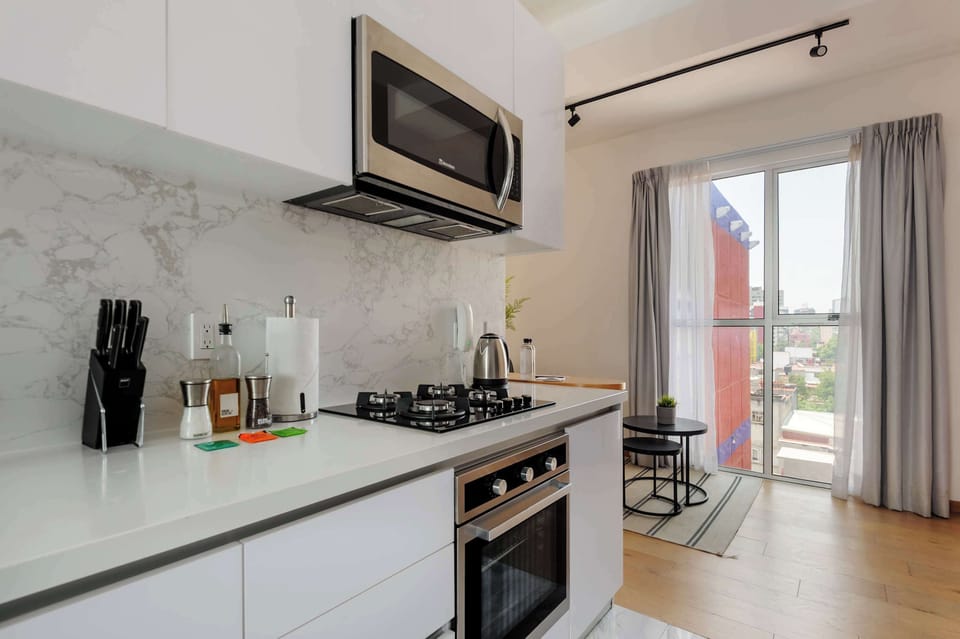 Fully equipped kitchen with sleek cabinetry.