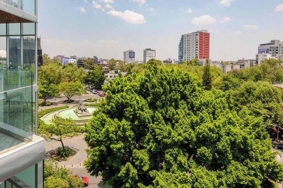 Beautiful green park and skyline views from the apartment’s large windows.
