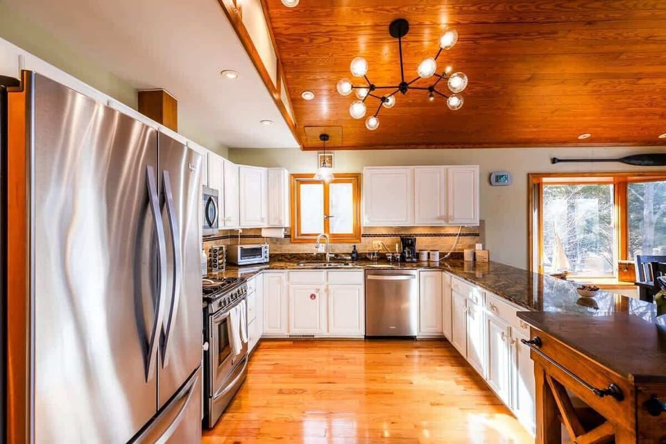 Come on inside! Our bright and functional kitchen with waterview is stylish and immersive space where you can enjoy cooking, dining, and the natural beauty of the waterfront surroundings.