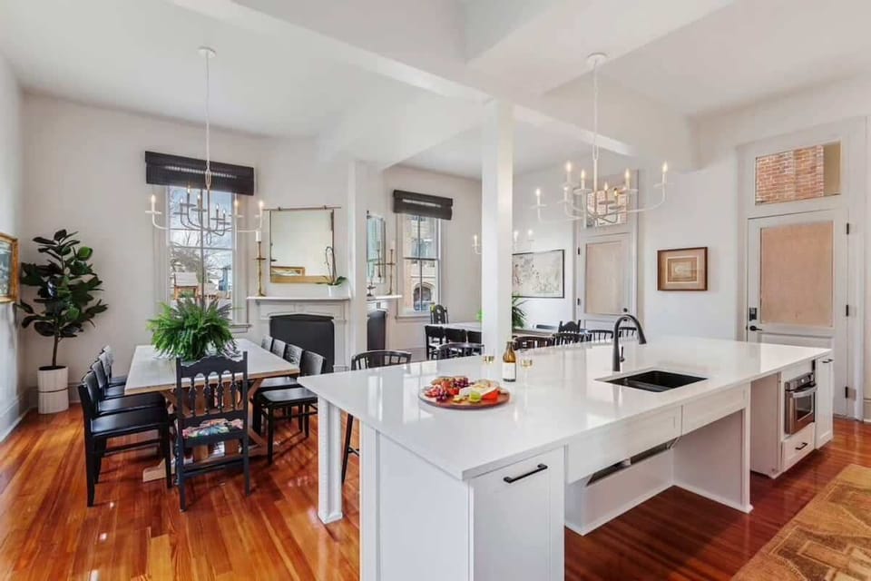 Kitchen and Dining Area | Chef's Kitchen with Island and Two Dining Tables Seating up to 20 Guests | First Floor