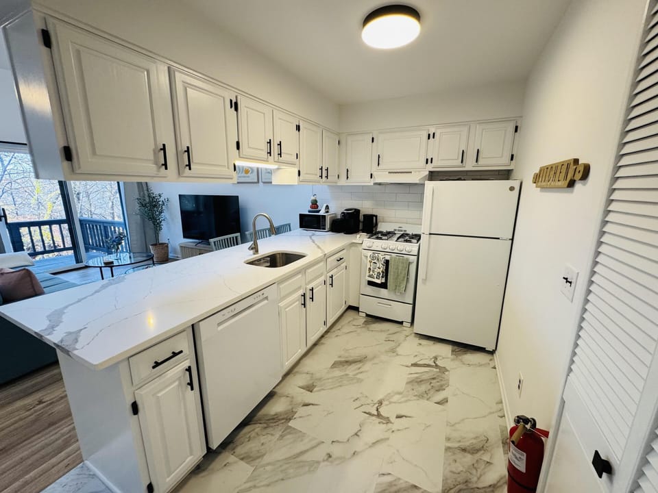Newly renovated full kitchen with all you need to cook and serve family meals