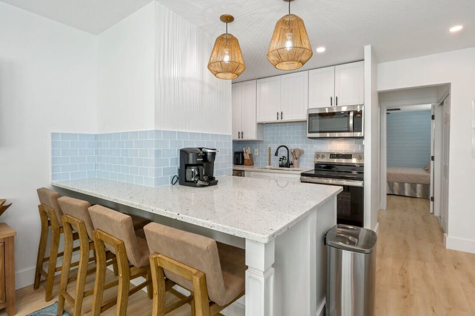 Open-concept living space with the kitchen just beside the cozy living room, creating a seamless flow for both cooking and relaxation.
