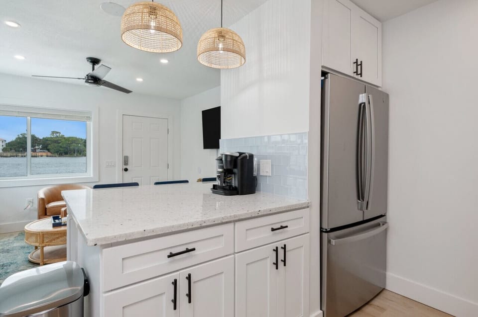An empty fridge, a tidy countertop, and a coffee maker ready to brew your perfect morning.