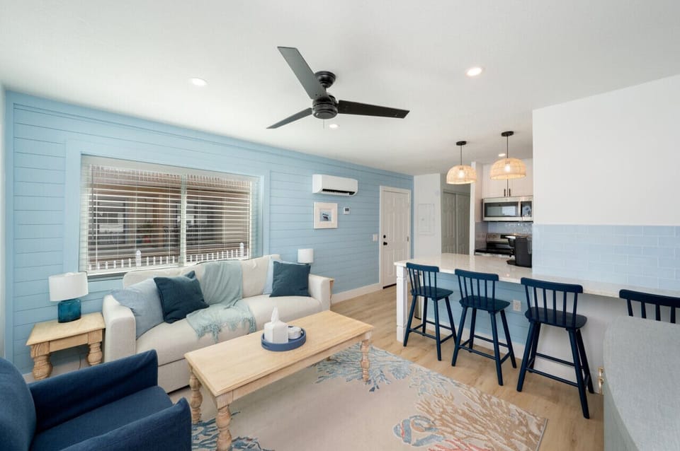Open-concept living space with the kitchen just beside the cozy living room, creating a seamless flow for both cooking and relaxation.