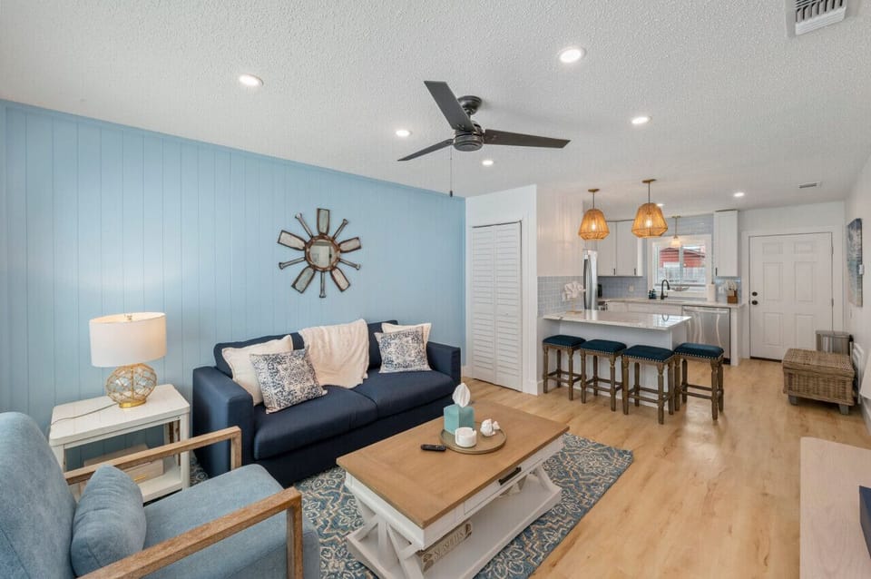 Open-concept living space with the kitchen just beside the cozy living room, creating a seamless flow for both cooking and relaxation.