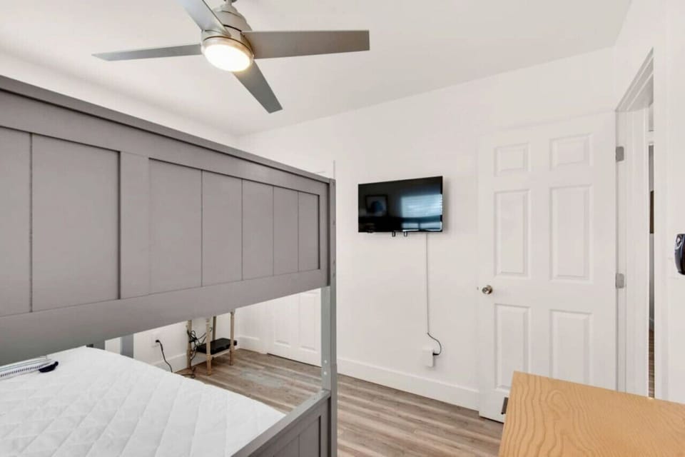 Experience a peaceful and relaxing sleep in this spacious bedroom featuring bunk bed