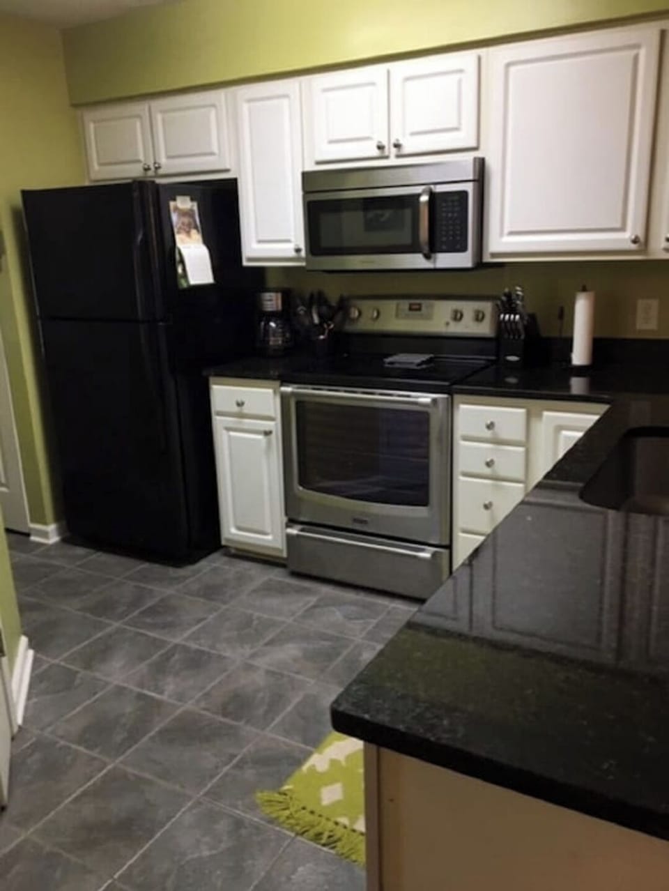 Kitchen with ceramic tile floor and granite counter tops