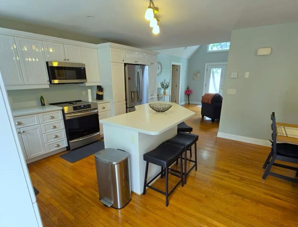 Driveway door enters into spacious open kitchen & dining area.