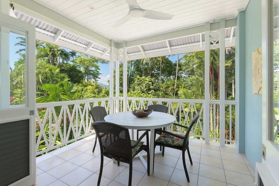 Your private balcony offers views over lush greenery, with swaying palms and colourful foliage creating a tranquil setting.  The perfect spot to relax and soak in the beauty of nature right from your private oasis