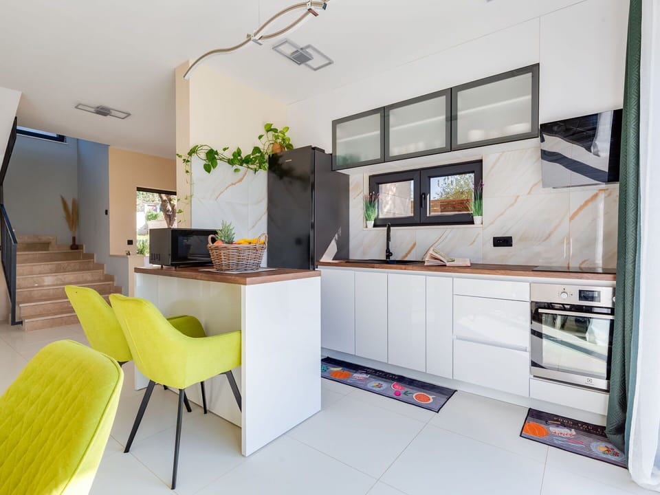 Furniture, Cabinetry, Building, Table, Countertop, Chair, Computer Desk, Interior Design, Houseplant, Couch