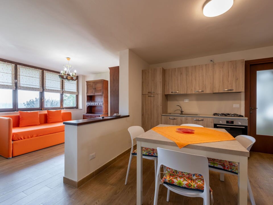 Furniture, Table, Property, Cabinetry, Window, Countertop, Orange, Wood, Lighting, Interior Design