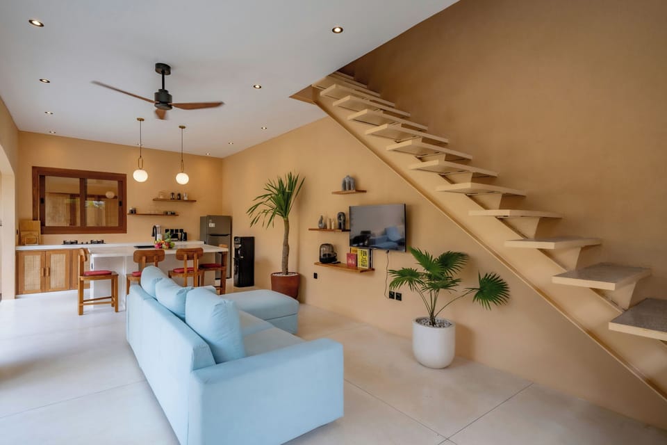 Deluxe Villa, Patio, Pool View | Living area | 50-inch Smart TV with cable channels