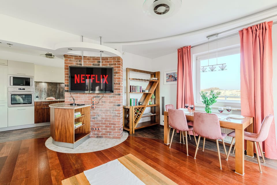 Comfort Apartment, Balcony, Courtyard View | Living area | 40-inch LCD TV with digital channels