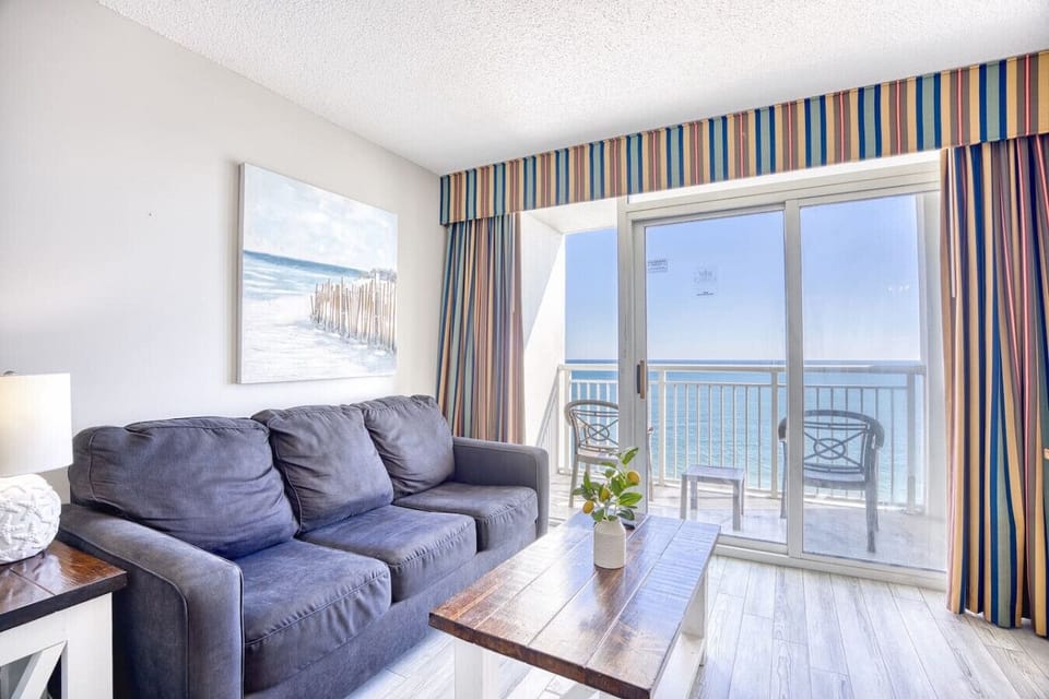 Living Room: Inviting space with ocean views, plush seating, and vibrant coastal decor awaits you!