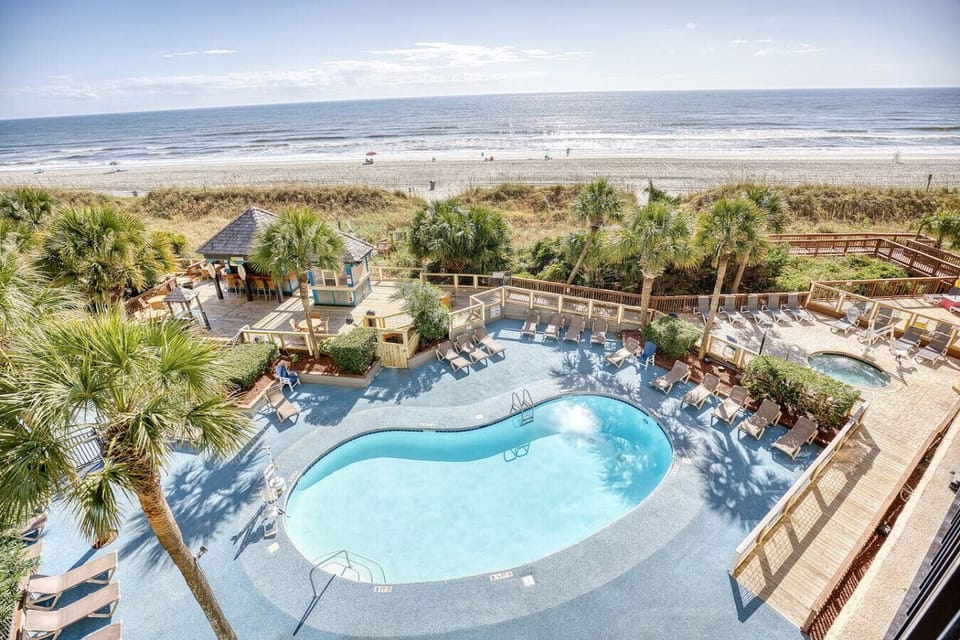 Room View from balcony of Tower B.  Enjoy Oceanfront, Beachfront, and Poolside vista from your room’s balcony.