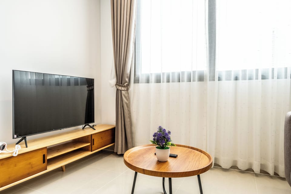 Comfort Condo, 1 Queen Bed, River View | Living room | 43-inch Smart TV with digital channels