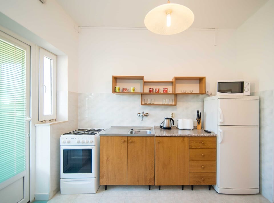 Apartment (Two Bedroom Apartment with Balcony an) | Living room | 32-inch flat-screen TV with cable channels