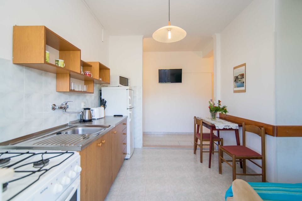 Apartment (Two Bedroom Apartment with Balcony an) | Living room | 32-inch flat-screen TV with cable channels