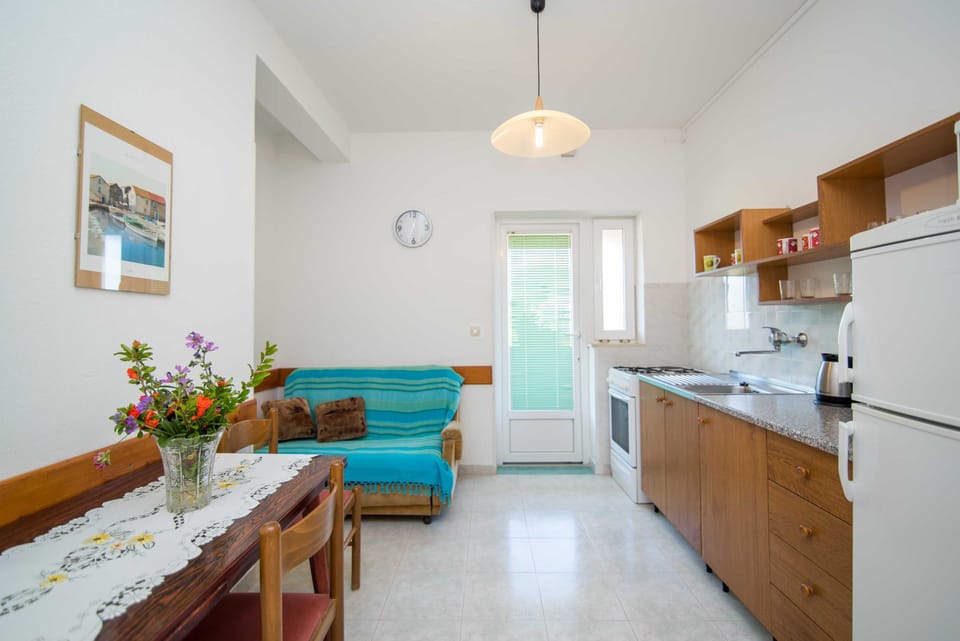 Apartment (Two Bedroom Apartment with Balcony an) | Living room | 32-inch flat-screen TV with cable channels