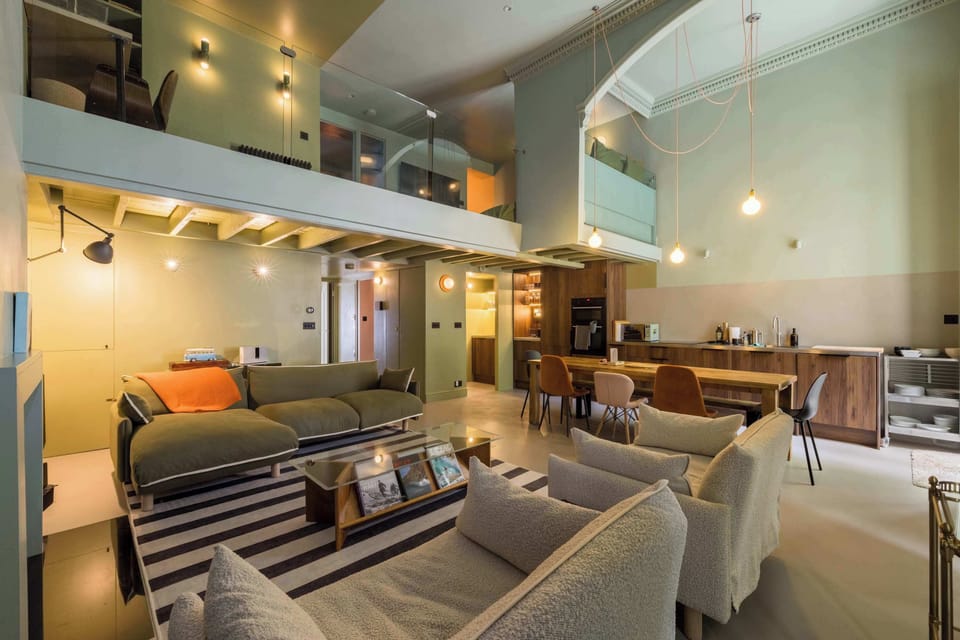 Open-plan kitchen with 10-seater dining table and spacious living room