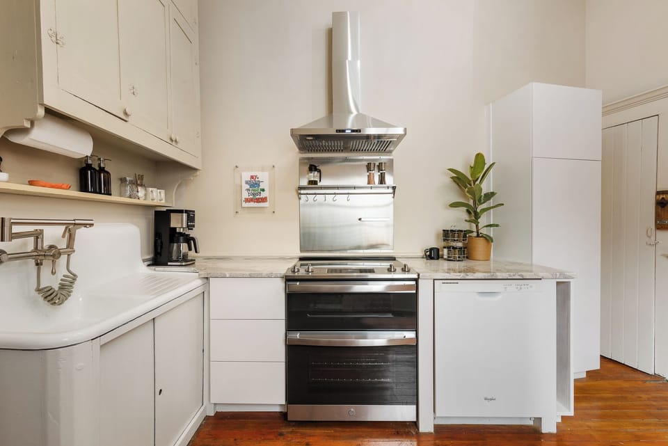 Cool vintage sink, double oven, and pantry oh my!