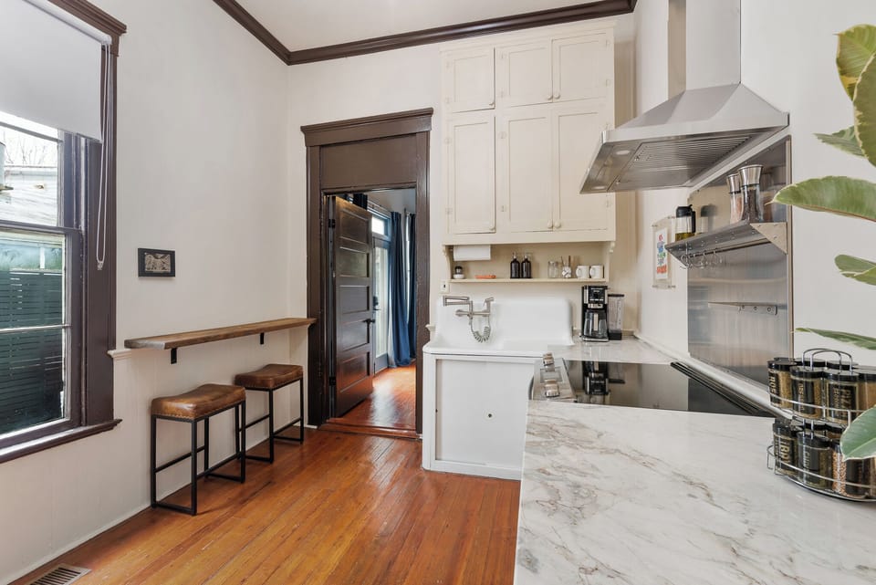 Modern updated kitchen with double oven and vintage details.