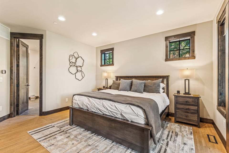 Primary master suite — king bed with direct access to the private spa