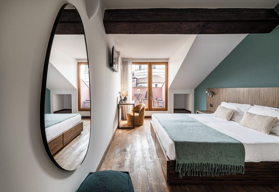 Comfort Room, 1 Queen Bed, Private Bathroom, City View | Desk, laptop workspace, iron/ironing board, free WiFi