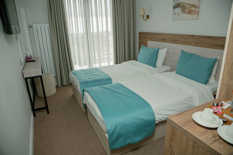 Deluxe Double or Twin Room, Balcony | In-room safe, laptop workspace, iron/ironing board (on request)
