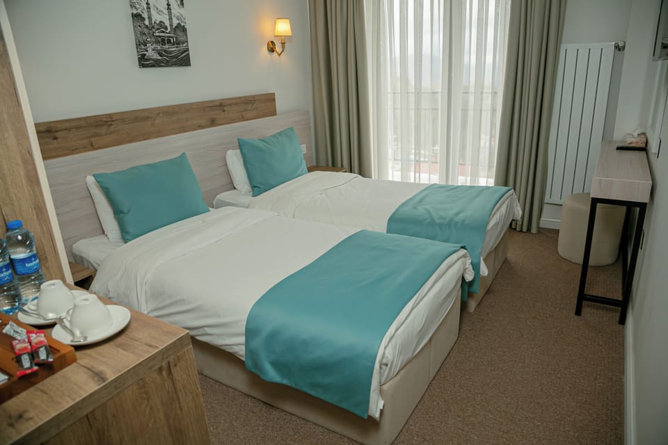 Deluxe Double or Twin Room, Balcony | In-room safe, laptop workspace, iron/ironing board (on request)