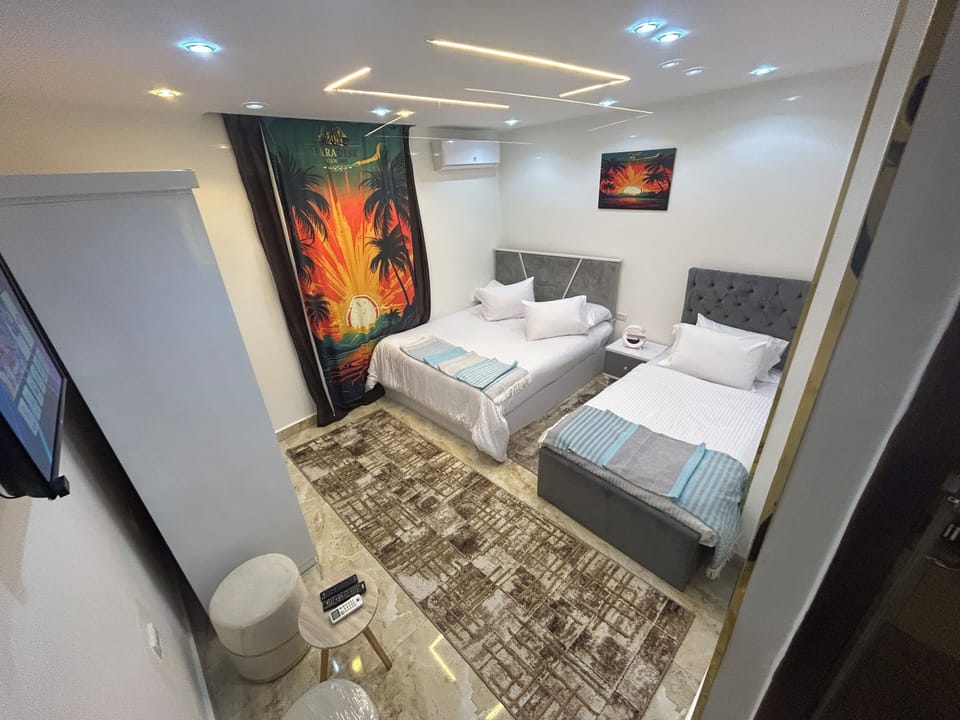 Standard Triple Room | Pillowtop beds, minibar, soundproofing, iron/ironing board