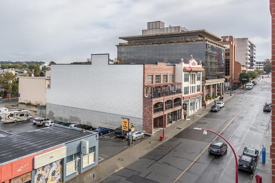 Broad exterior view from the private outdoor deck overlooking surrounding heritage buildings and Old Town Victoria.