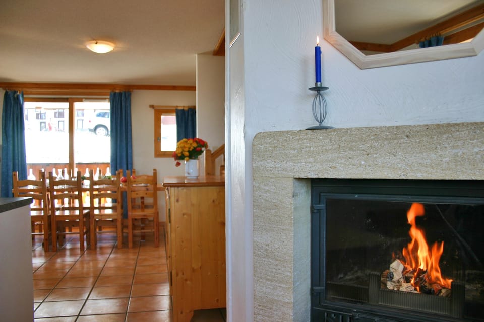 Take a seat in front of the fireplace and enjoy a movie.