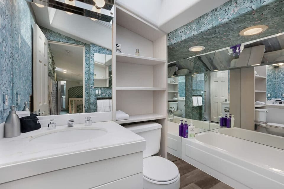 Bedroom 2: Queen bed in loft with en suite bathroom (tub, no shower)