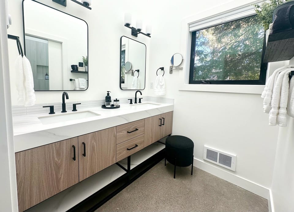 The stylish main bathroom's dual vanities provide plenty of space to get ready