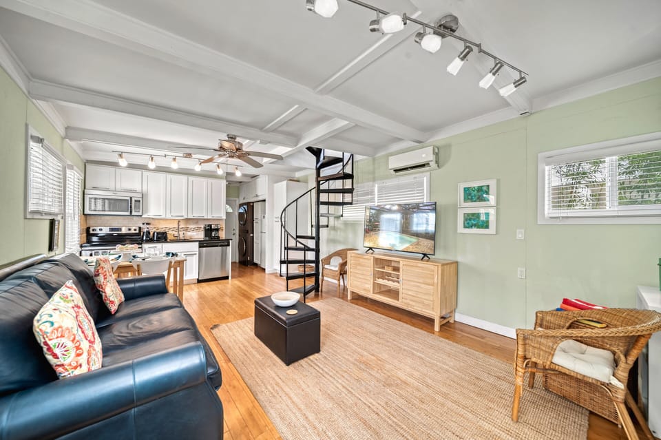 Cozy and coastal, this living space is made for kicking back after beach days—windows open, feet up, breeze flowing.