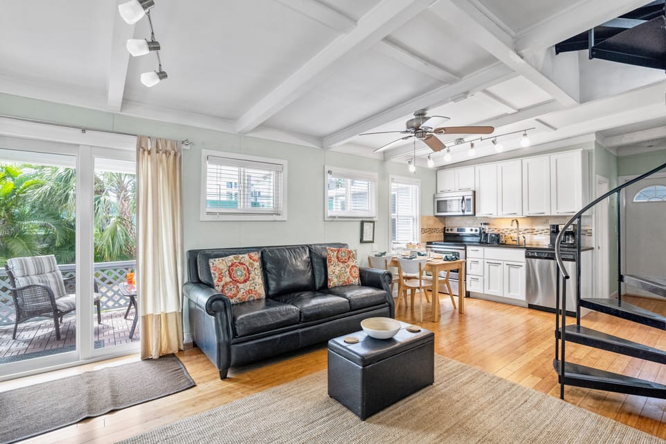From the front porch to the open kitchen, this cottage flows effortlessly—designed for comfort, conversation, and coastal simplicity.