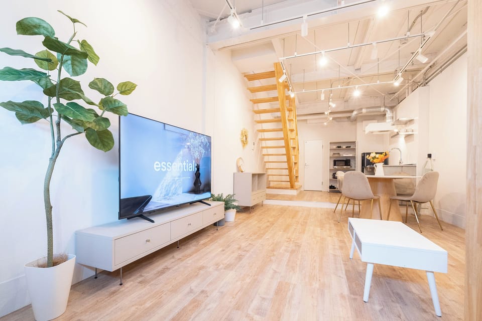 Superior Villa | Living area | 65-inch flat-screen TV with cable channels
