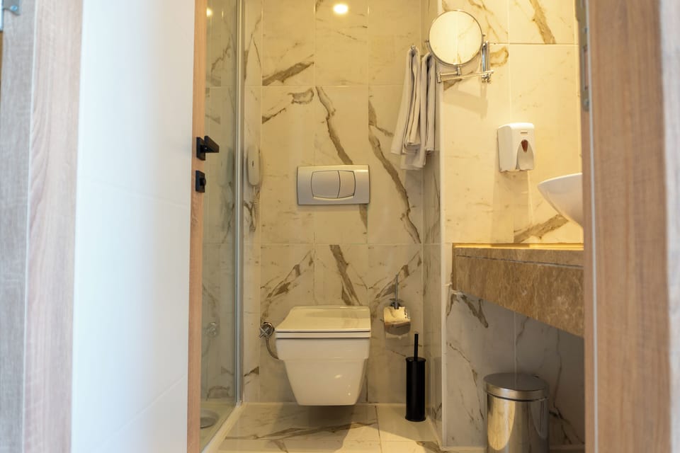 Bathtub, hair dryer, towels