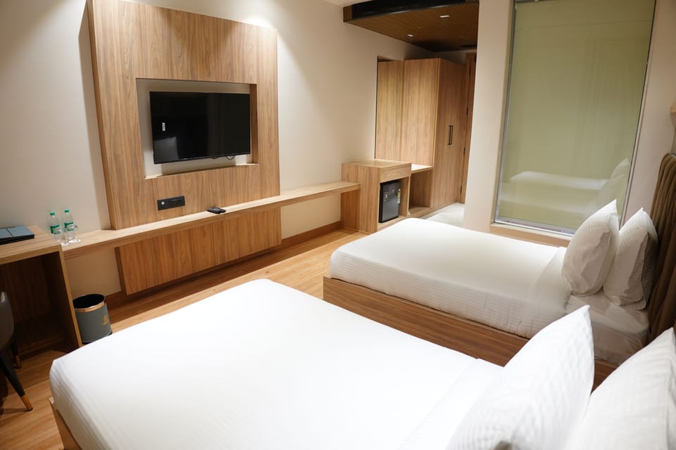 Deluxe Double or Twin Room, City View | Premium bedding, minibar, desk, laptop workspace