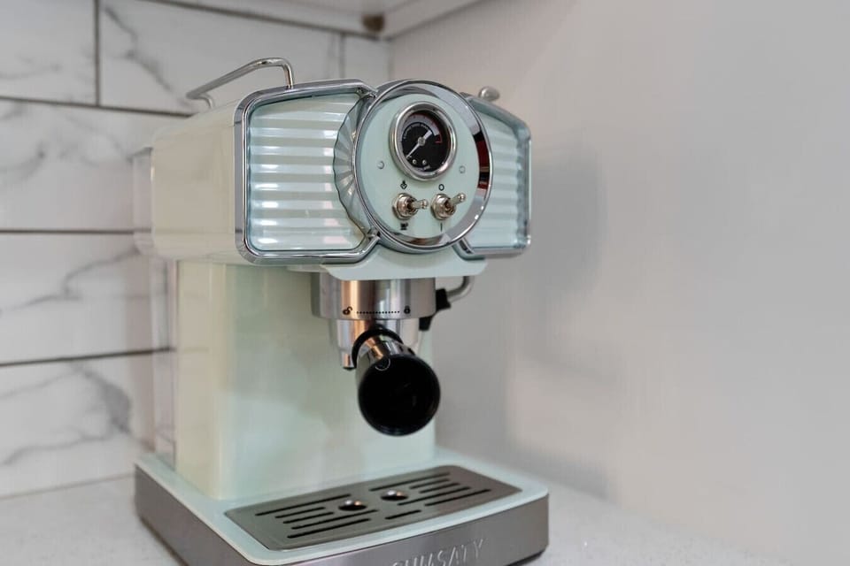 Retro-style espresso and coffee machine in the kitchen, groovy vintage vibes for your morning brew, Vivid Vintage Orlando