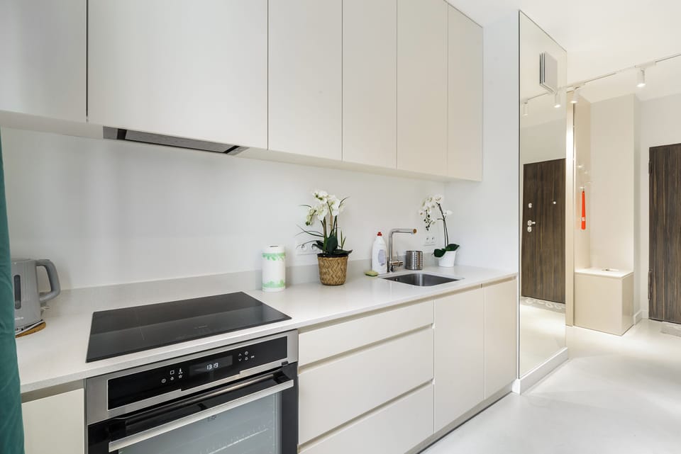 Deluxe Apartment, Balcony, Courtyard View | Private kitchen | Fridge, oven, stovetop, electric kettle