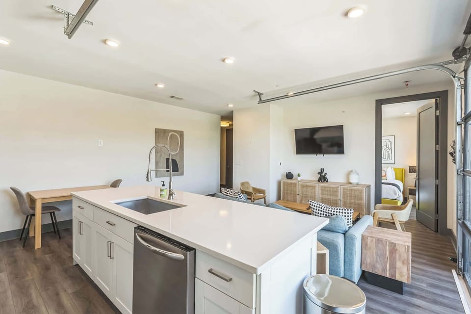 Full kitchen and table with seating for 2