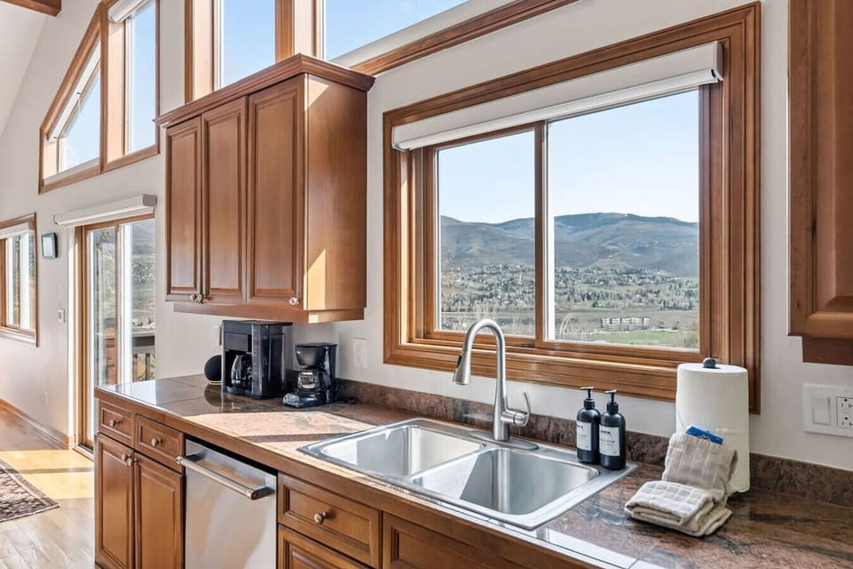 Chef’s kitchen with granite counters and modern appliances