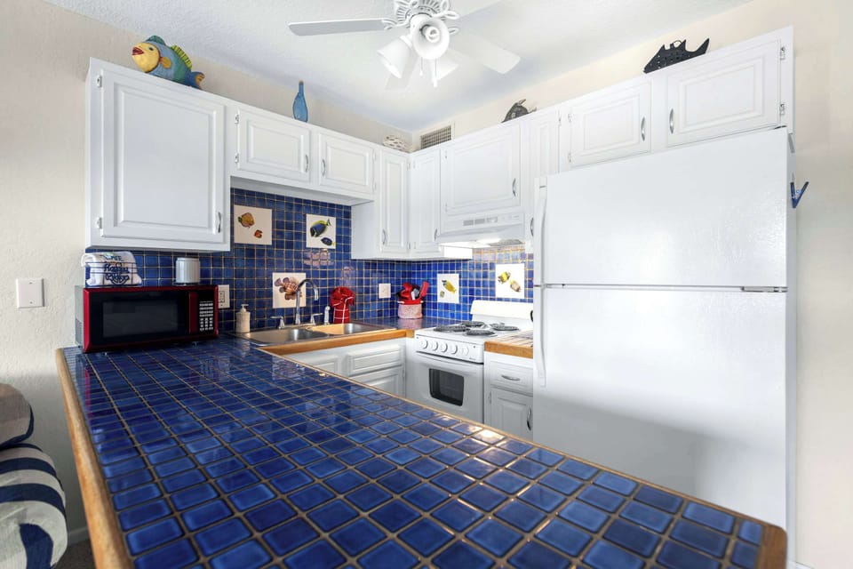 The cozy kitchen is efficiently designed and equipped with all the essentials you need