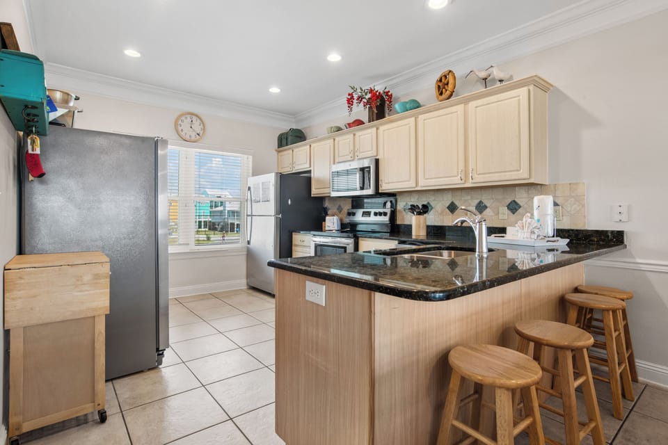 Open concept kitchen with stainless steel appliances